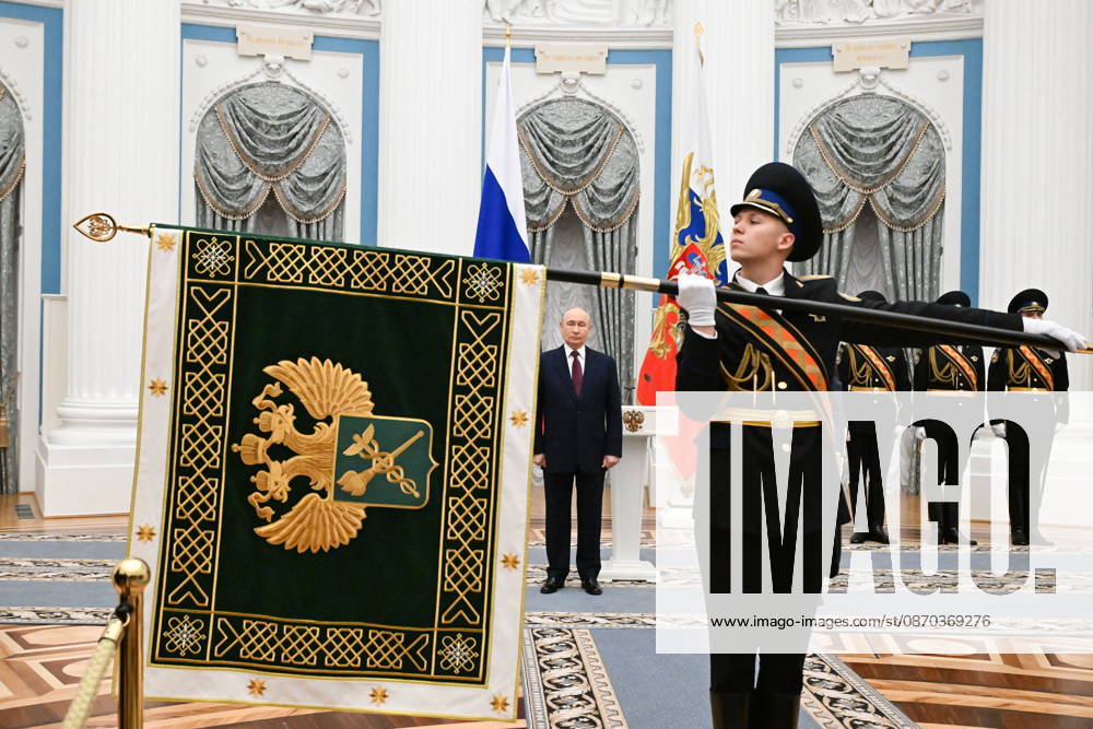 RUSSIA, MOSCOW - OCTOBER 22, 2026: Russia s President Vladimir Putin (C back) attends a ceremony to present the banner of the Federal Customs Service of Russia to the agency s head Pikalev (not pictured). Approved by a presidential decree in 2019, the banner has not yet been presented to the agency s top official Moscow Russia - ZUMAt113 20261022_zaa_t113_347
