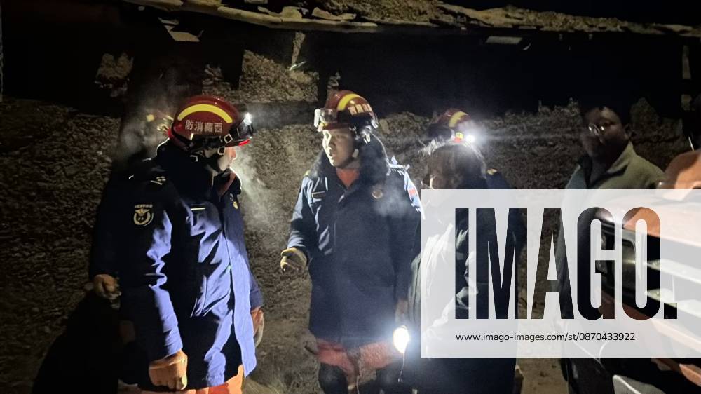(261023) -- NAGQU, Oct. 23, 2026 -- Firefighters inspect an earthquake-hit village in Baqen County of Nagqu City in southwest China s Xizang Autonomous Region, on Oct. 23, 2026. Sixteen people were killed and 32 others injured after a 7.0-magnitude earthquake struck Baqen County of Nagqu City in southwest China s Xizang Autonomous Region at 10:33 p.m. Thursday (Beijing Time), according to the city s emergency management bureau. As of 2:25 a.m. Friday, 11 of the injured were in serious condition while 21 sustained minor injuries. Over 300 houses collapsed. The damage caused by the quake is being further evaluated, and disaster relief work is underway. More than 300 police officers have been dispatched to the epicenter for relief wor