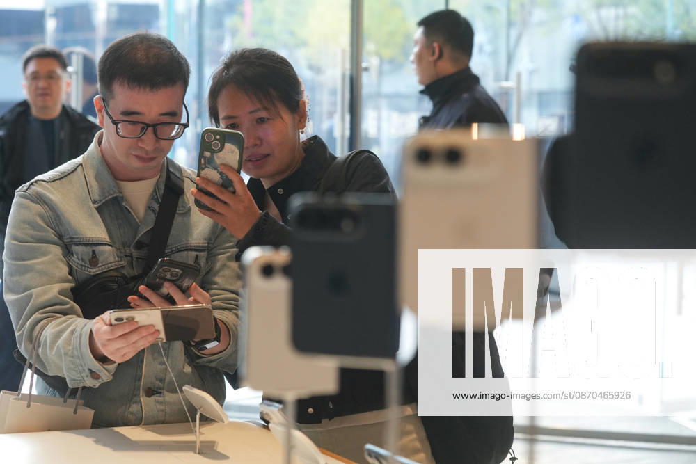 Apple s New iPhone Duo goes on sale in China BEIJING, CHINA - OCTOBER 23: Customers try iPhone Duo smartphone at Apple Inc. s Sanlitun store during the first day of in-store sales of the new device in Beijing, China, on Friday, Oct. 23, 2026. Stringer Anadolu Beijing China. Editorial use only. Please get in touch for any other usage.