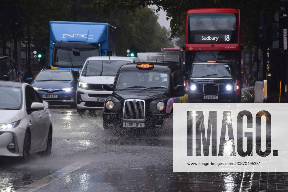 Taxis and cars pass through a waterlogged Euston Road as Storm Austen brings rain to the capital. London United Kingdom - ZUMAv130 20261023_zip_v130_010