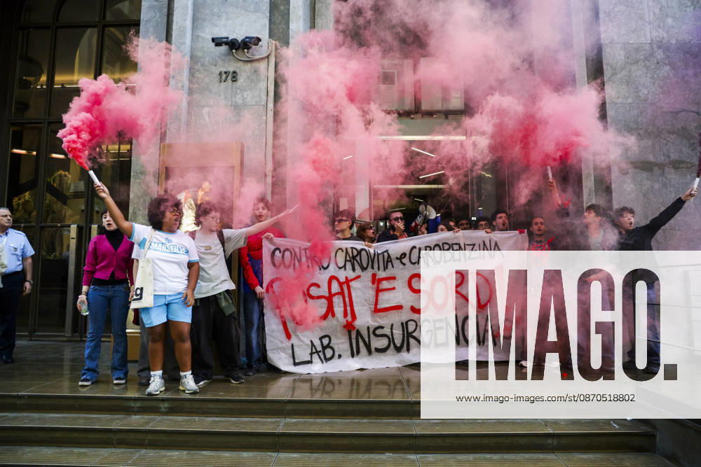 Activists Target Banks Over Cost-of-Living Crisis Activists from Insurgencia, together with the Argo and Kaos collectives, are organising a protest outside the Intesa Sanpaolo offices on Via Toledo in Naples. Some protesters are dressed as Spider-Man and are waving banners bearing the Neapolitan slogan ˜Pusate e sord!. The activists accuse the banks of continuing to make excessive profits whilst ordinary people face growing financial hardship, and criticise the Meloni government for its response to the recent disruptions to fuel and food supplies. Napoli October 23 2026, ABP17456