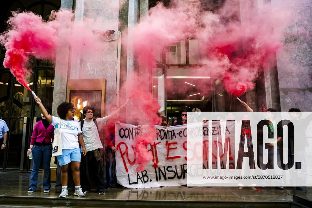 Activists Target Banks Over Cost-of-Living Crisis Activists from Insurgencia, together with the Argo and Kaos collectives, are organising a protest outside the Intesa Sanpaolo offices on Via Toledo in Naples. Some protesters are dressed as Spider-Man and are waving banners bearing the Neapolitan slogan ˜Pusate e sord!. The activists accuse the banks of continuing to make excessive profits whilst ordinary people face growing financial hardship, and criticise the Meloni government for its response to the recent disruptions to fuel and food supplies. Napoli October 23 2026, ABP17465