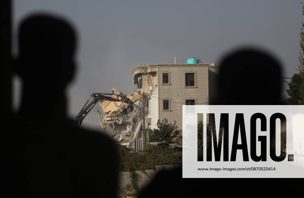Israeli forces demolish a building in West Bank city of Hebron HEBRON, WEST BANK, PALESTINE - OCTOBER 23: Israeli military heavy machinery demolishes a building during a raid in the West Bank city of Hebron, Palestine, on October 23, 2026. The Israeli military announced earlier in the morning that two of its soldiers were killed during armed clashes with Palestinians, triggering a large-scale military operation and structural demolition in the city. Mamoun Wazwaz Anadolu Hebron West Bank. Editorial use only. Please get in touch for any other usage.
