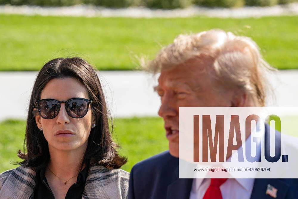 White House Press Secretary DANIELLE ALVAREZ stands alongside President DONALD TRUMP as he speaks to members of the press before departing the White House for a political rally in Fort Myers, Florida. Washington United States - ZUMAk206 20261023_znp_k206_026