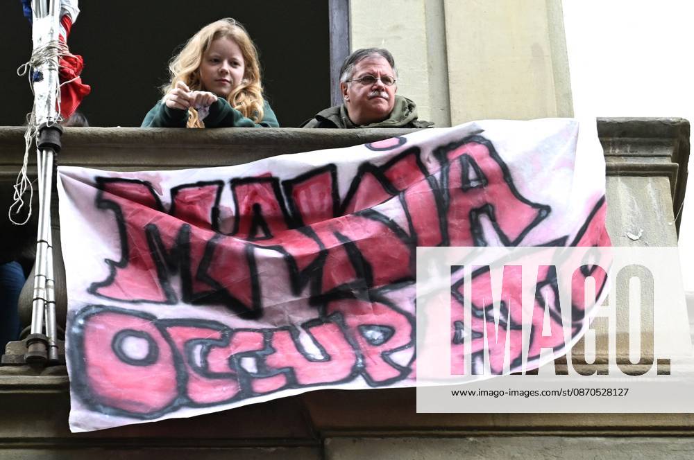 In front of the Machiavelli High School on Via Santo Spirito, a group of teachers held an open lesson on the street with megaphones and signs, addressing students leaning out of their windows and standing in front of the occupied school s door. Florence, October 23, 2026 Florence Italy - ZUMAa289 20261023_zia_a289_109
