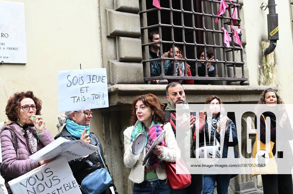 In front of the Machiavelli High School on Via Santo Spirito, a group of teachers held an open lesson on the street with megaphones and signs, addressing students leaning out of their windows and standing in front of the occupied school s door. Florence, October 23, 2026 Florence Italy - ZUMAa289 20261023_zia_a289_116