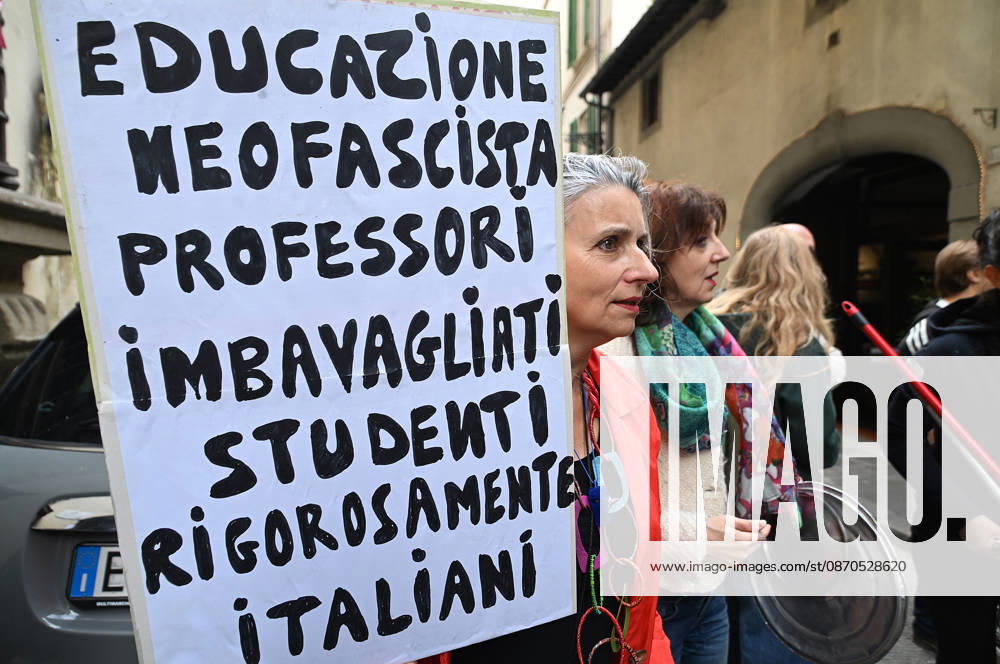 In front of the Machiavelli High School on Via Santo Spirito, a group of teachers held an open lesson on the street with megaphones and signs, addressing students leaning out of their windows and standing in front of the occupied school s door. Florence, October 23, 2026 Florence Italy - ZUMAa289 20261023_zia_a289_119