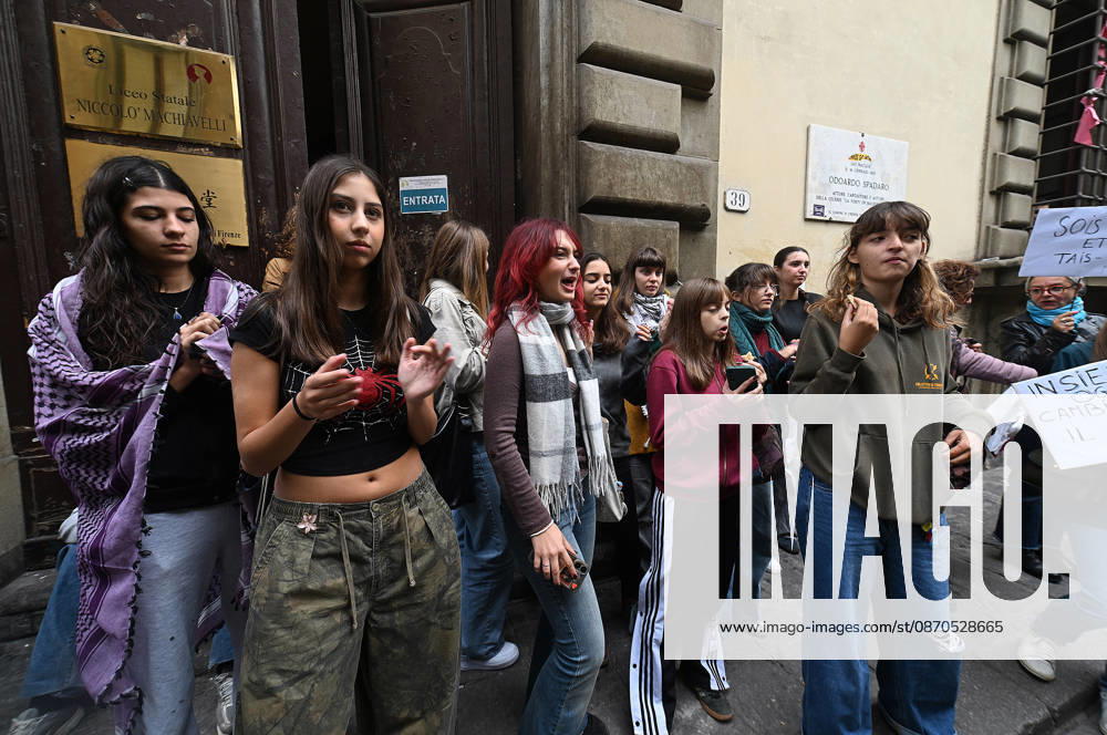 In front of the Machiavelli High School on Via Santo Spirito, a group of teachers held an open lesson on the street with megaphones and signs, addressing students leaning out of their windows and standing in front of the occupied school s door. Florence, October 23, 2026 Florence Italy - ZUMAa289 20261023_zia_a289_125