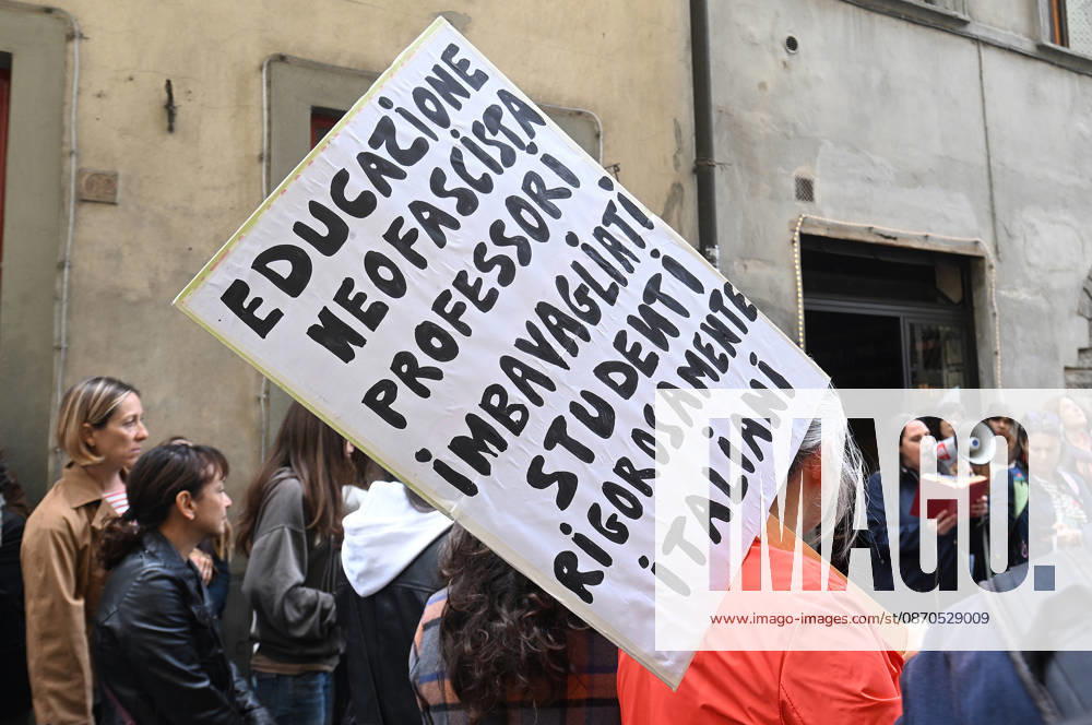 In front of the Machiavelli High School on Via Santo Spirito, a group of teachers held an open lesson on the street with megaphones and signs, addressing students leaning out of their windows and standing in front of the occupied school s door. Florence, October 23, 2026 Florence Italy - ZUMAa289 20261023_zia_a289_129
