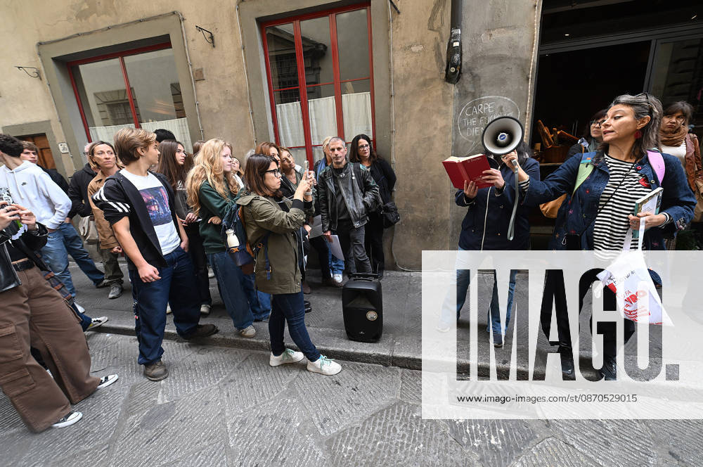 In front of the Machiavelli High School on Via Santo Spirito, a group of teachers held an open lesson on the street with megaphones and signs, addressing students leaning out of their windows and standing in front of the occupied school s door. Florence, October 23, 2026 Florence Italy - ZUMAa289 20261023_zia_a289_131