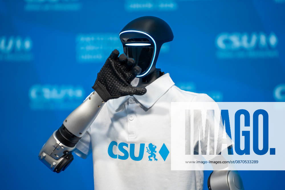 Munich, Bavaria, Germany October 23, 2026: The 2026 party convention of the CSU (Christian Social Union) at the Munich Trade Fair Center. The Unitree G1 humanoid robot from the Chinese manufacturer Unitree Robotics, wearing a white CSU polo shirt