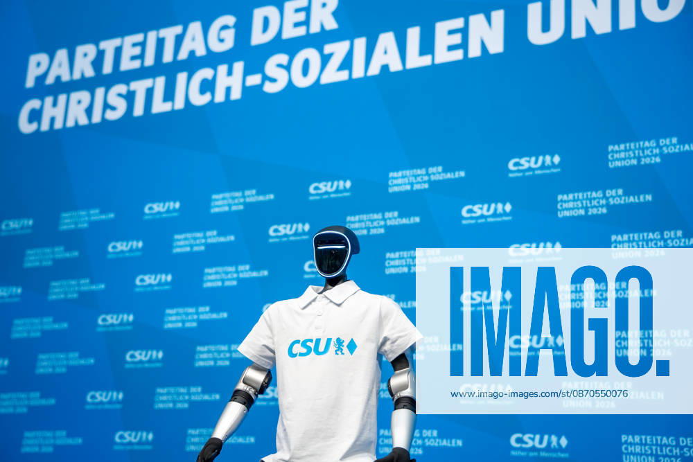 Munich, Bavaria, Germany October 23, 2026: The 2026 party convention of the CSU (Christian Social Union) at the Munich Trade Fair Center. The Unitree G1 humanoid robot from the Chinese manufacturer Unitree Robotics, wearing a white CSU polo shirt
