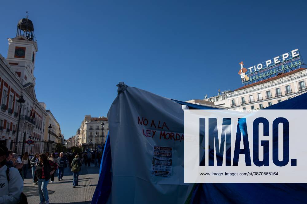 A banner with the phrase No to the gag law (Ley Mordaza) can be seen at Puerta del Sol..Tents remain set up by housing rights activists, who organized the occupation of the square in response to the eviction of MaricarmenÃ¢â‚¬a woman in her eightiesÃ¢â‚¬from her home, carried out by a real estate investment fund. Madrid Spain - ZUMAs197 20261023_aaa_s197_151