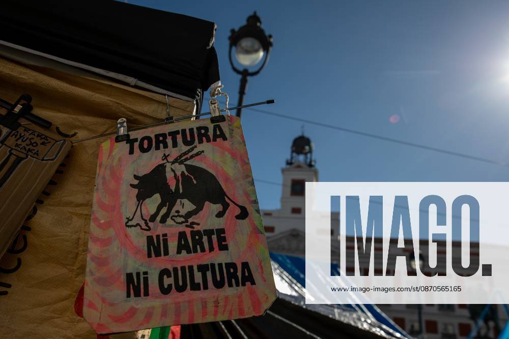 A banner featuring the phrase tortureâ€neither art nor culture and an image of a bull can be seen at Puerta del Sol..Tents remain set up by housing rights activists, who organized the occupation of the square in response to the eviction of Maricarmenâ€a woman in her eightiesâ€from her home, carried out by a real estate investment fund. Madrid Spain - ZUMAs197 20261023_aaa_s197_155