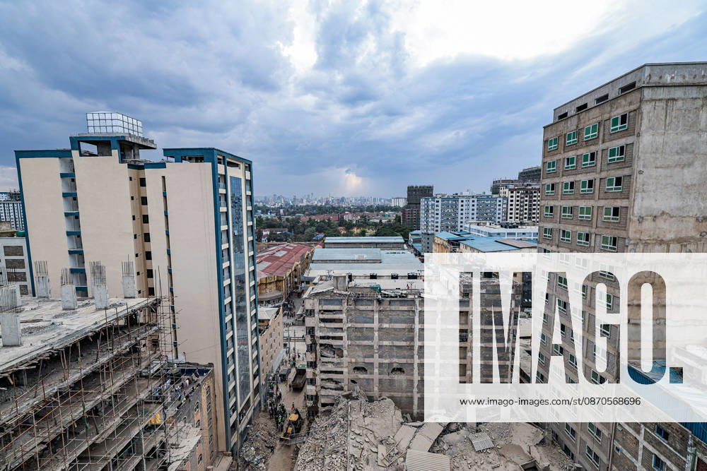 Debris from a collapsed multi-storey building lies between neighbouring buildings in Eastleigh as rescue operations continue at the site. Rescuers from multiple emergency response agencies conduct search and rescue operations at the site of a collapsed multi-storey building under construction in Eastleigh, Nairobi, Kenya. An unconfirmed number of people are feared trapped beneath the rubble. Nairobi Kenya - ZUMAs197 20261023_aaa_s197_290