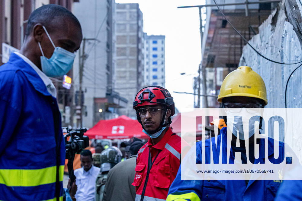 A member of the Kenya Red Cross rescue and Kenya power team during the search operations at the site of a collapsed multi-storey building under construction in Eastleigh. Rescuers from multiple emergency response agencies conduct search and rescue operations at the site of a collapsed multi-storey building under construction in Eastleigh, Nairobi, Kenya. An unconfirmed number of people are feared trapped beneath the rubble. Nairobi Kenya - ZUMAs197 20261023_aaa_s197_317