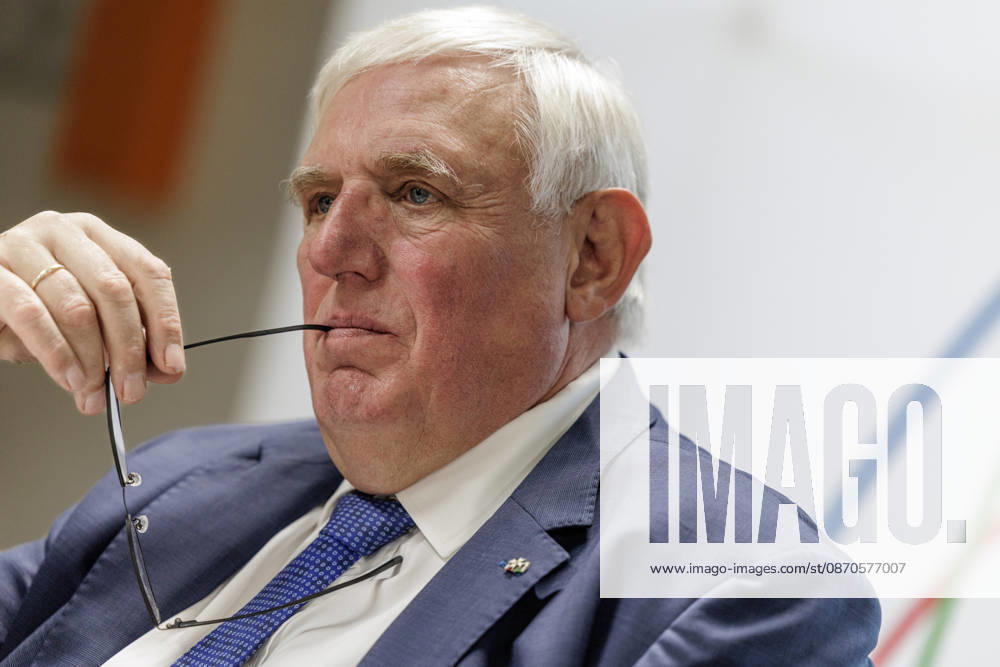 Karl Josef Laumann (CDU), Minister of Labor and Social Affairs for North Rhine-Westphalia, held the arm of his glasses in the corner of his mouth on October 23, 2026, during a WVS business breakfast at the Caritas Emstor Workshops (WfbM) in Rheine, North Rhine