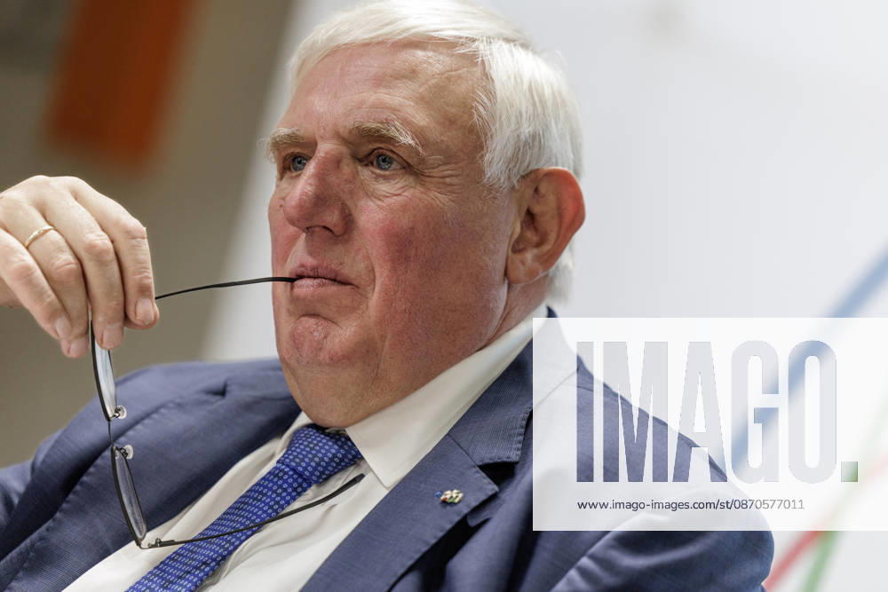 Karl Josef Laumann (CDU), Minister of Labor and Social Affairs for North Rhine-Westphalia, held the arm of his glasses in the corner of his mouth on October 23, 2026, during a WVS business breakfast at the Caritas Emstor Workshops (WfbM) in Rheine, North Rhine