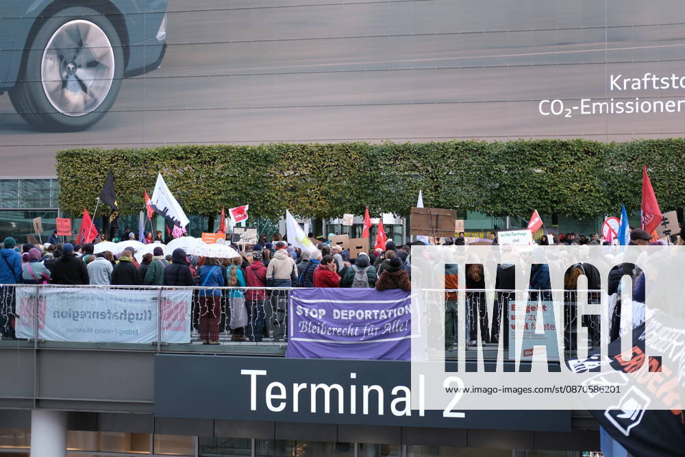 Protest at Munich Airport against planned deportation terminal MUNICH, GERMANY - OCTOBER 24: Protesters gather on a terrace outside Terminal 2 at Munich Airport holding banners during a demonstration against a planned deportation terminal in Munich, Germany on October 24, 2026. The rally is directed against a facility the federal government plans to use for mass deportations from 2028. Merve Goettl Anadolu Munich Germany. Editorial use only. Please get in touch for any other usage.