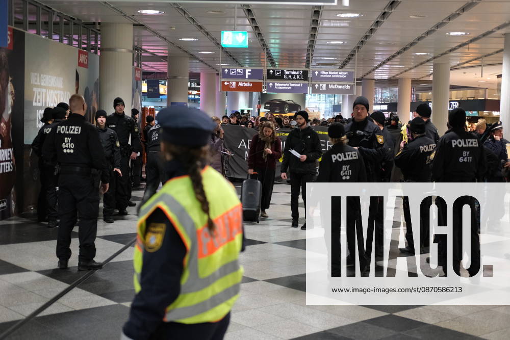 Protest at Munich Airport against planned deportation terminal MUNICH, GERMANY - OCTOBER 24: German police officers surround protesters holding a banner inside the terminal building at Munich Airport in Munich, Germany on October 24, 2026. The demonstration was held against a planned deportation terminal that the federal government intends to operate at the airport from 2028. Merve Goettl Anadolu Munich Germany. Editorial use only. Please get in touch for any other usage.
