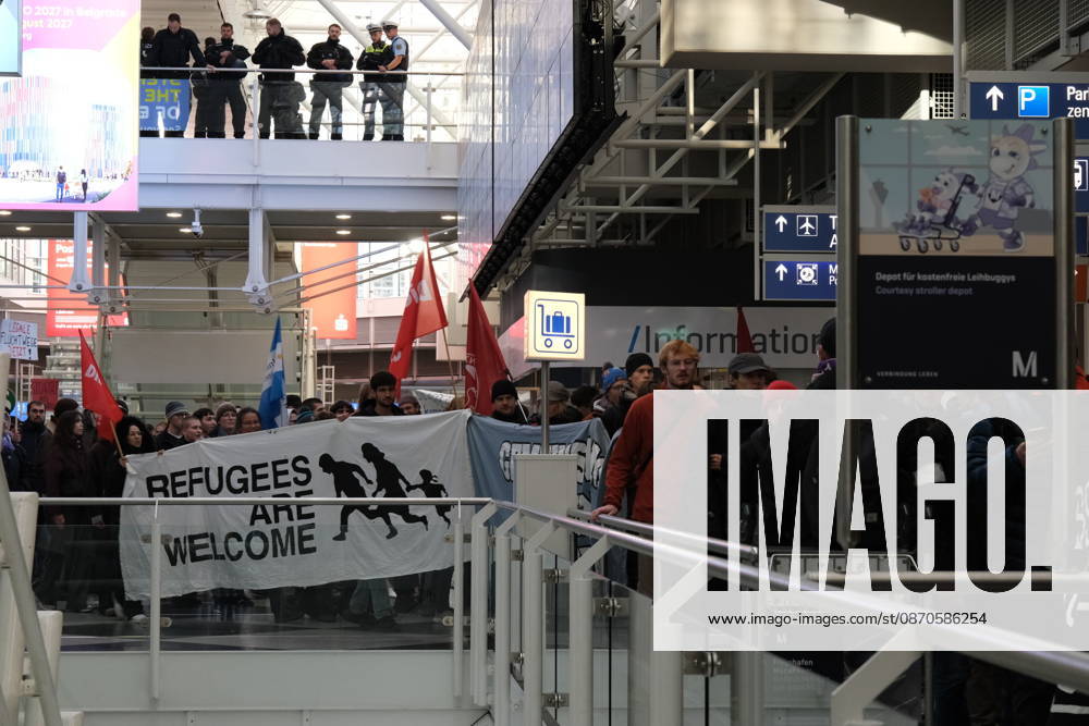 Protest at Munich Airport against planned deportation terminal MUNICH, GERMANY - OCTOBER 24: Protesters carry a banner reading Refugees Are Welcome and red flags through the terminal of Munich Airport as police officers watch from an upper level in Munich, Germany on October 24, 2026. The demonstration targets a planned deportation terminal at the airport backed by Germany s federal government. Merve Goettl Anadolu Munich Germany. Editorial use only. Please get in touch for any other usage.