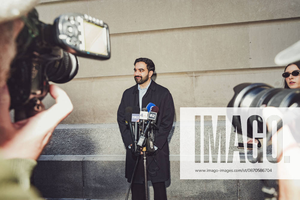Press photographers take photographs of New York City Mayor ZOHRAN MAMDANI as he listens to a question from a reporter outside the Metropolitan Museum of Art where he had just cast his early voting ballot. New York USA - ZUMAp287 20261024_znp_p287_013