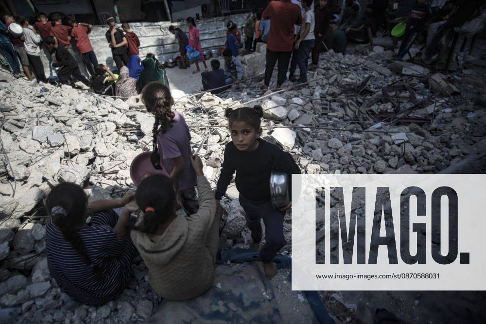Gaza Palestinians Food Shortages 2026 Palestinian children sit together among the rubble of destroyed buildings while waiting near a food distribution point in Jabalia Refugee Camp, northern Gaza Strip, Palestine, on October 24, 2026. The UN reports that damaged infrastructure, displacement and shortages of basic supplies continue to affect residents of Gaza, while funding shortages have reduced food assistance. Jabalia Gaza Strip Palestinian Territories