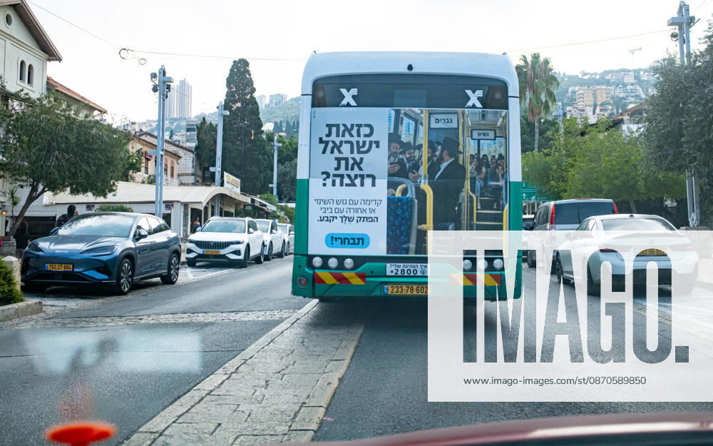 2026 Elections in Israel, Israel, Haifa, October 24, 2026 A public transit bus in Haifa with a large campaign sticker on the back. The