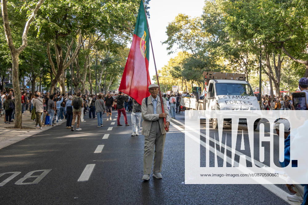 Demonstrators take part in a protest organized by the Acampada de Lisboa housing movement, demanding affordable housing, limits on rising rents and an end to property speculation. The march takes place in central Lisbon, from Marques de Pombal to Rossio Square, following recent police removal of protest tents and the detention of 55 demonstrators during housing protests in the Portuguese capital. Lisbon Portugal - ZUMAr238 20261024_zip_r238_063