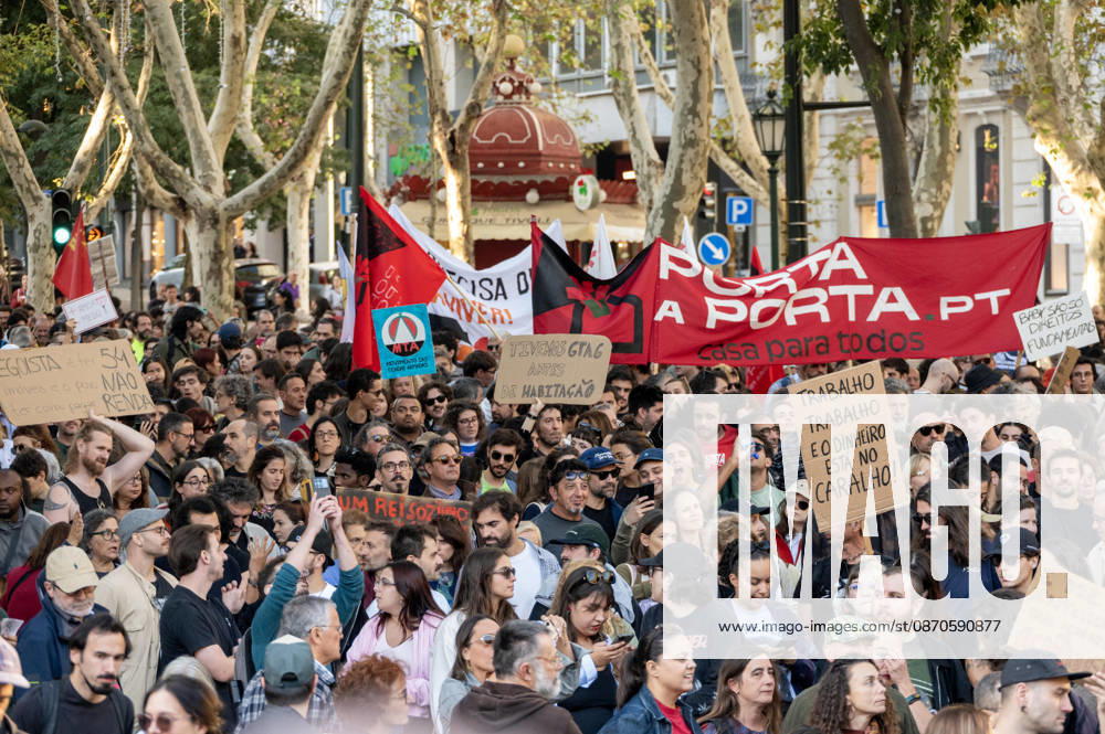 Demonstrators take part in a protest organized by the Acampada de Lisboa housing movement, demanding affordable housing, limits on rising rents and an end to property speculation. The march takes place in central Lisbon, from Marques de Pombal to Rossio Square, following recent police removal of protest tents and the detention of 55 demonstrators during housing protests in the Portuguese capital. Lisbon Portugal - ZUMAr238 20261024_zip_r238_078