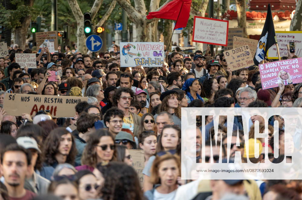Demonstrators take part in a protest organized by the Acampada de Lisboa housing movement, demanding affordable housing, limits on rising rents and an end to property speculation. The march takes place in central Lisbon, from Marques de Pombal to Rossio Square, following recent police removal of protest tents and the detention of 55 demonstrators during housing protests in the Portuguese capital. Lisbon Portugal - ZUMAr238 20261024_zip_r238_051