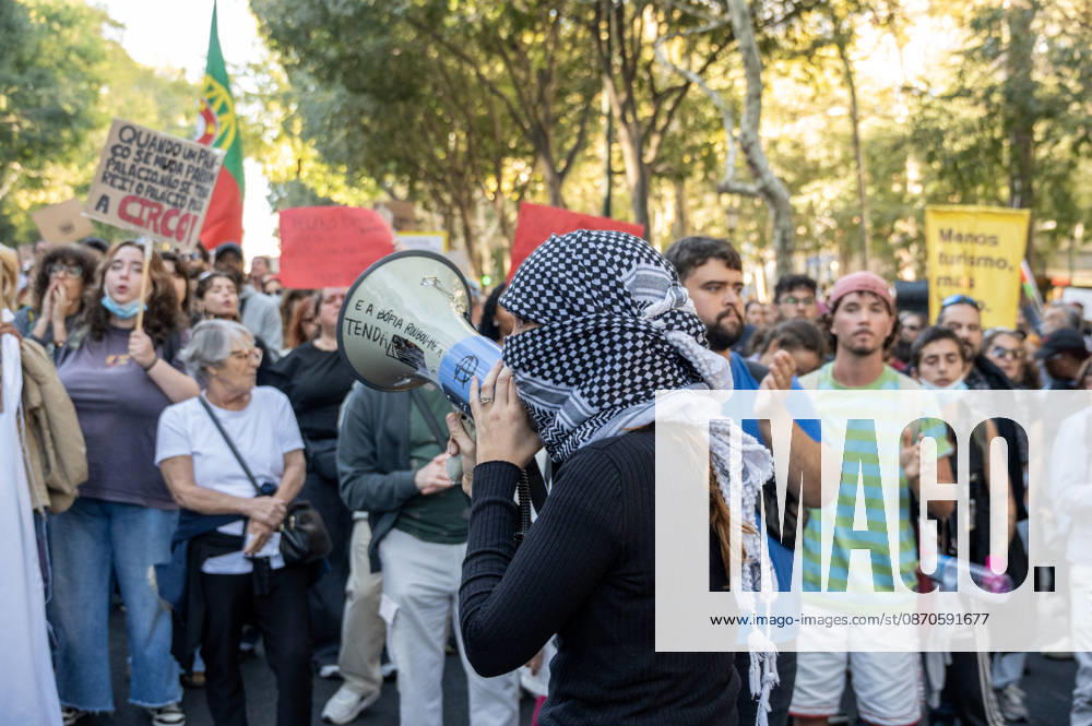 Demonstrators take part in a protest organized by the Acampada de Lisboa housing movement, demanding affordable housing, limits on rising rents and an end to property speculation. The march takes place in central Lisbon, from Marques de Pombal to Rossio Square, following recent police removal of protest tents and the detention of 55 demonstrators during housing protests in the Portuguese capital. Lisbon Portugal - ZUMAr238 20261024_zip_r238_047