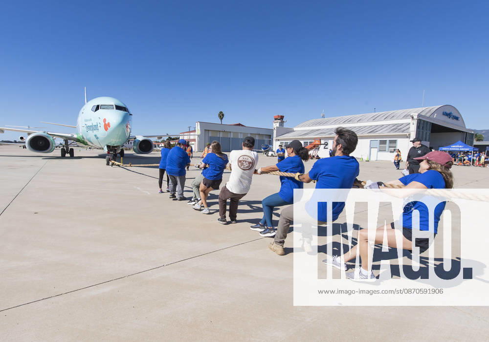 Teams compete in the 5th annual Alpha Resource Center Plane Pull, trying to pull a 140,000-pound Alaska Airlines 737 jetliner 20 feet in the fastest time. The event is a fundraiser for the Alpha Resource Center, a nonprofit serving people with disabilities and their families. Santa Barbara USA - ZUMAh13_ 20261024_zaf_h13_003