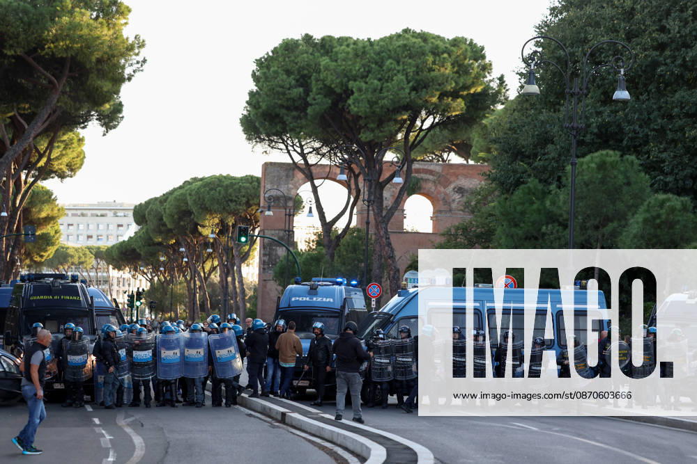 (261024) -- ROME, Oct. 24, 2026 -- Police stand guard near Circo Massimo for an anti-war march in Rome, Italy, Oct. 24, 2026. Protests over rising living costs, military expansion and increased arms spending swept across several Italian cities on Saturday, with clashes between demonstrators and police reported in multiple locations. In Rome, demonstrators set off from Piazza della Repubblica, according to the ANSA news agency. Clashes erupted between protesters and police in the city center later in the evening, prompting police to use water cannons and tear gas in an attempt to disperse the crowds. ) ITALY-ROME-PROTESTS WangxKaiyan