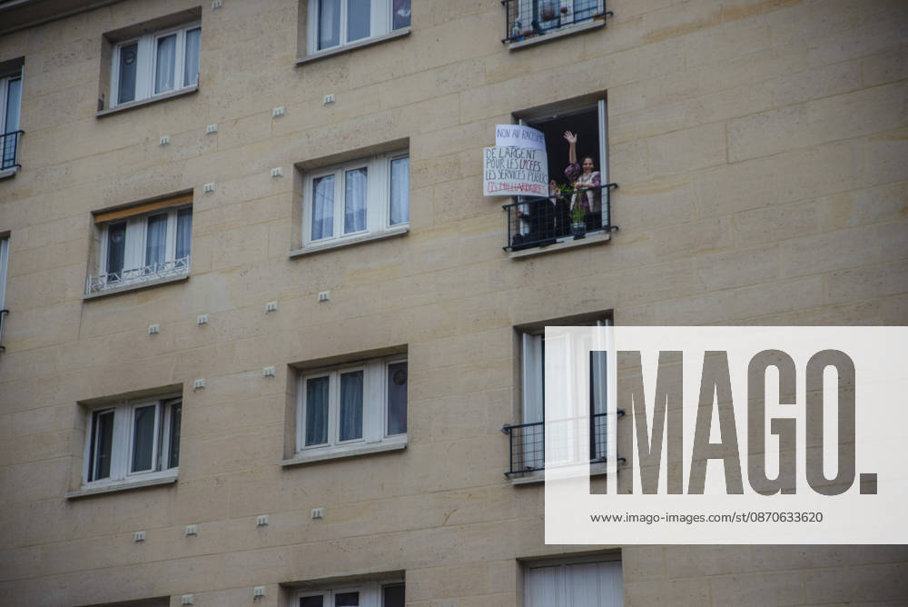 Paris Street Protest A resident displays a placard reading No to racism. Money for high schools and public services, not for billionaires from a building window during a demonstration in Paris, France on October 24, 2026. Authorities deployed around 70,000 security personnel across France for renewed protests over the cost of living on October 24, after unrest a week earlier saw public buildings vandalized, hundreds of shops looted and about 2,700 people arrested. Paris Ile de France France