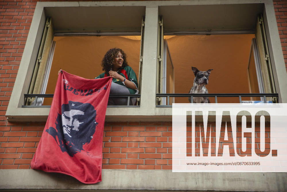 Paris Street Protest A resident displays a cloth bearing a portrait of Che Guevara from a building window during a demonstration in Paris, France on October 24, 2026. Authorities deployed around 70,000 security personnel across France for renewed protests over the cost of living on October 24, after unrest a week earlier saw public buildings vandalized, hundreds of shops looted and about 2,700 people arrested. Paris Ile de France France