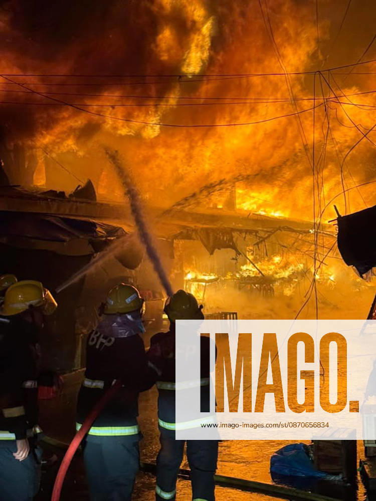 (261025) -- SORSOGON, Oct. 25, 2026 -- Firefighters try to put out a fire at a public market in Sorsogon city of southern Luzon, the Philippines, on Oct. 25, 2026. Five people have been confirmed dead after a fire in a public market here on Saturday night, local media reported Sunday. ( Handout via Xinhua) (SpotNews) PHILIPPINES-SORSOGON-PUBLIC MARKET-FIRE ThexPhilippines xBureauxofxFirexProtection