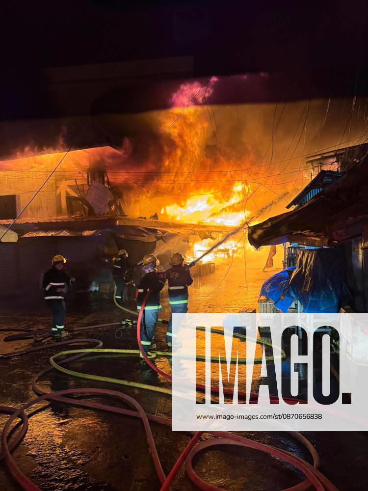 (261025) -- SORSOGON, Oct. 25, 2026 -- Firefighters try to put out a fire at a public market in Sorsogon city of southern Luzon, the Philippines, on Oct. 25, 2026. Five people have been confirmed dead after a fire in a public market here on Saturday night, local media reported Sunday. ( Handout via Xinhua) (SpotNews) PHILIPPINES-SORSOGON-PUBLIC MARKET-FIRE ThexPhilippines xBureauxofxFirexProtection
