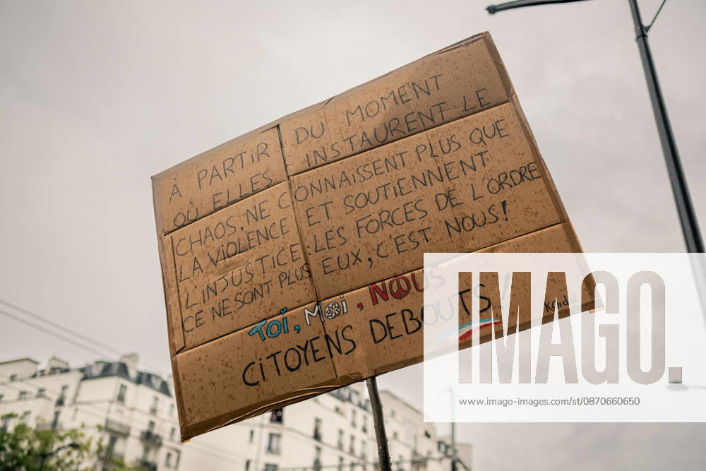 Yellow Vests Protest Act II - Paris Demonstrators carry placards displaying political messages during a march against the rising cost of living and for social justice in Paris, France, on October 24, 2026. The protest follows the boulevards des Maréchaux from Porte d’Italie to Porte de Vincennes, with calls for higher wages and better funding for public services and education. Photo by Jules Bernard ABACAPRESS.COM Paris Île-de-France France