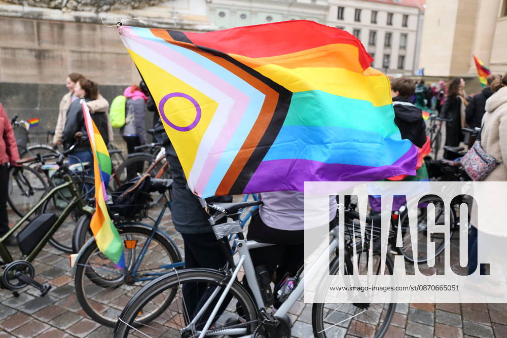 Protesters stand with a rainbow flag on the Alter Markt during Bike Pride in Potsdam, October 24, 2026 Bike Pride Potsdam