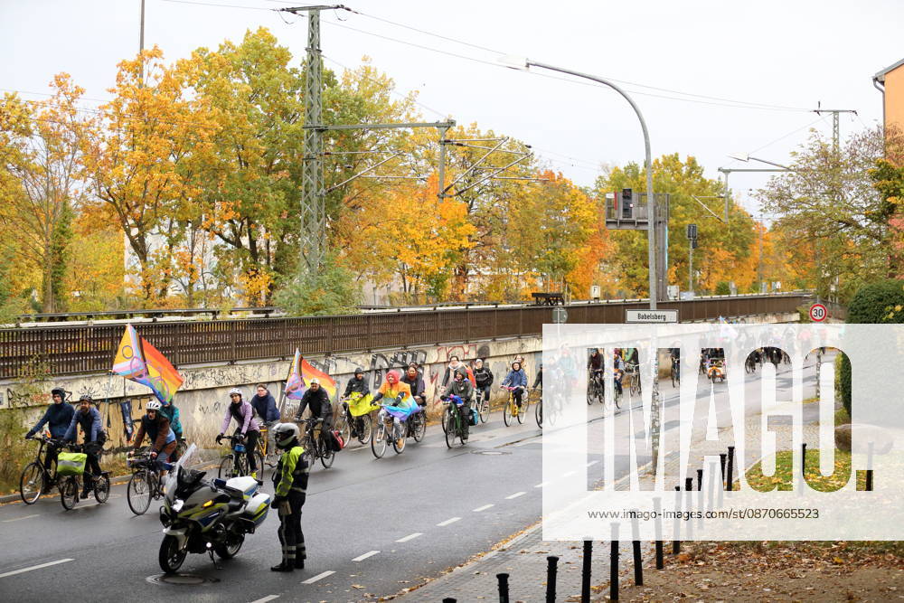 Protesters ride down Friedrich Engels Street waving rainbow flags during Bike Pride in Potsdam, October 24, 2026 Bike Pride Potsdam