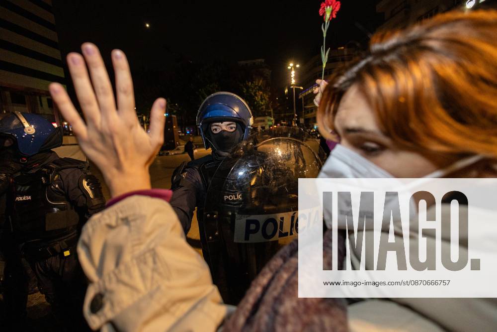 Police officers and protesters clash during the overnight clearance of the housing protest camp at Praça D. João I. Demonstrators remained at the housing protest camp in Praça D. João I, after voting during a public assembly to continue the occupation beyond the authorized protest period. Police issued repeated warnings before advancing shortly after 3 a.m. with riot police, special intervention units and police dogs to clear the encampment. Protesters formed human chains around the tents and clashes occurred as officers dismantled the camp. Following the operation, demonstrators regrouped at Avenida dos Aliados in front of Porto City Hall, where the protest continued. Porto Portugal - ZUMAs197 20261025_aaa_s197_012