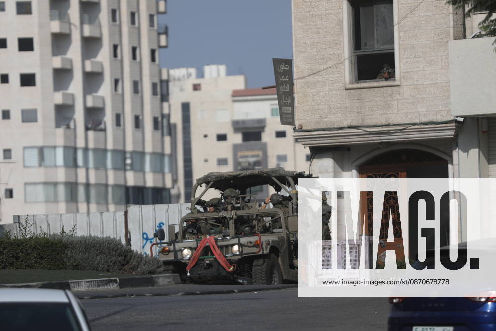 Israeli Soldiers and Military Vehicles Deployed Across Hebron Amid Ongoing Operation Israeli soldiers and military vehicles are deployed along streets in the West Bank city of Hebron, on October 25, 2026, as an Israeli military operation continues for the third consecutive day. The operation involves road closures, restrictions on Palestinian movement and the deployment of Israeli troops across several areas of the city. Photo by Mamoun Wazwaz apaimages Hebron West Bank Palestinian Territory 251026_Hebron_MW_00(4)