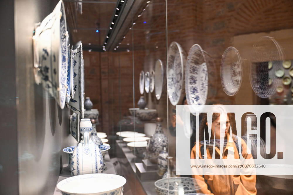 (261025) -- ISTANBUL, Oct. 25, 2026 -- A visitor views Chinese porcelain exhibits at the newly opened Porcelain Museum within the Topkapi Palace in Istanbul, T¨¹rkiye, Oct. 25, 2026. T¨¹rkiye on Saturday inaugurated a new museum district within Istanbul s historic Topkapi Palace, where thousands of Chinese porcelain pieces are on display, reflecting centuries of cultural exchanges between China and T¨¹rkiye. Restored into a historical neighborhood complete with its own streets and squares, the palace s former mint now houses the Porcelain Museum, which displays 5,300 pieces -- including 3,500 Chinese porcelains -- across 19 halls. Dating back to the 13th century, Chinese porcelains -- particularly those from Jingdezhen -- traveled