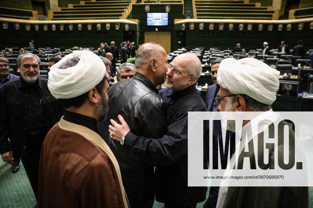 Mohammad Bagher Ghalibaf raises his hand to the side of another man s face while speaking between two clerics at the Islamic Consultative Assembly in Tehran, Iran, on October 25, 2026. The Islamic Consultative Assembly resumed an open sitting in its Tehran chamber with a mix of in-person and remote participation, according to parliamentary reporting. Tehran Iran - ZUMAi98_ 20261025_zih_i98_059