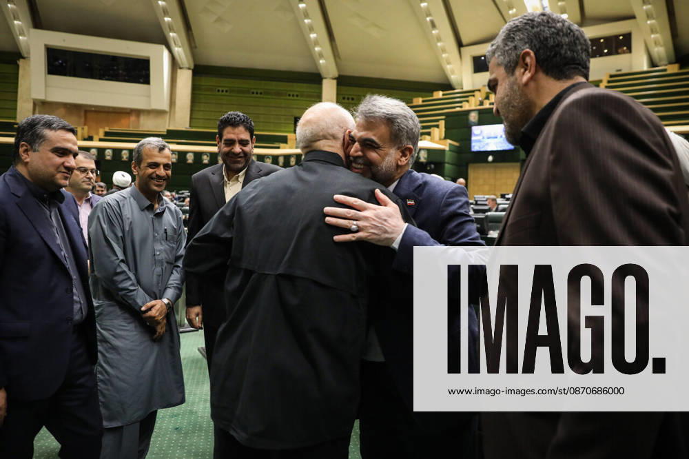 Mohammad Bagher Ghalibaf is greeted by several suited men as one of them touches another man s shoulder at the Islamic Consultative Assembly in Tehran, Iran, on October 25, 2026. The Islamic Consultative Assembly resumed an open sitting in its Tehran chamber with a mix of in-person and remote participation, according to parliamentary reporting. Tehran Iran - ZUMAi98_ 20261025_zih_i98_056