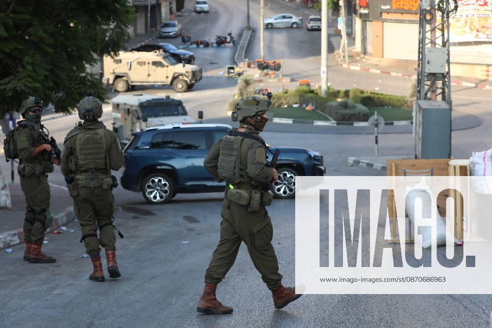 Strict security measures enforced in Hebron s Deir Bahha neighborhood HEBRON, WEST BANK, PALESTINE - OCTOBER 25: Israeli soldiers enforce strict security measures and maintain a military blockade in the Deir Bahha neighborhood of Hebron, West Bank, Palestine on October 25, 2026. The wide-scale military operation entered its third day following an armed attack at an Israeli military checkpoint in the Farsh al-Hawa area at the city s northwestern entrance on October 23, with troops sealing off roads and patrolling residential areas where the two Palestinian suspects involved in the incident lived. Wisam Hashlamoun Anadolu Hebron West Bank. Editorial use only. Please get in touch for any other usage.