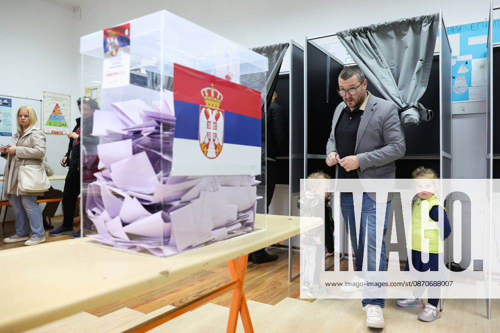 SERBIA, BELGRADE - OCTOBER 25, 2026: A man with his children casts his ballot at a polling station during the 2026 Serbian parliamentary election. On 25 October, the Serbs went to the polls to elect members of the country s unicameral parliament, Narodna Skupshtina. Alexander Ryumin TASS 99953440