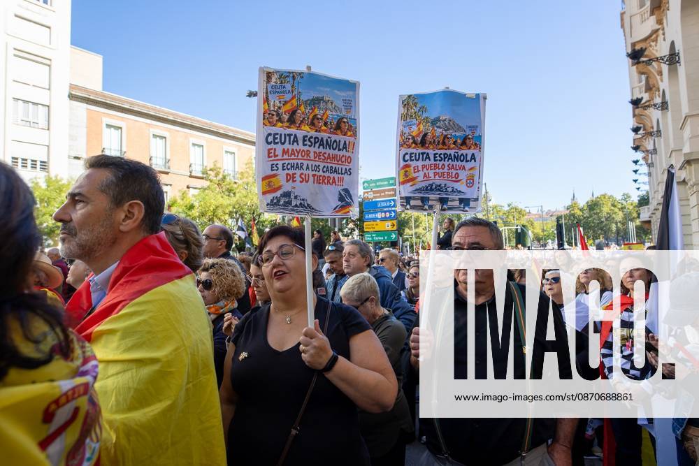 Protesters carry signs in support of the autonomous city of Ceuta..Thousands of people in Madrid have rallied in support of the demands made by women from Ceuta known locally as caballas who are calling for a return to normalcy in the autonomous city. Madrid Spain - ZUMAs197 20261025_aaa_s197_115