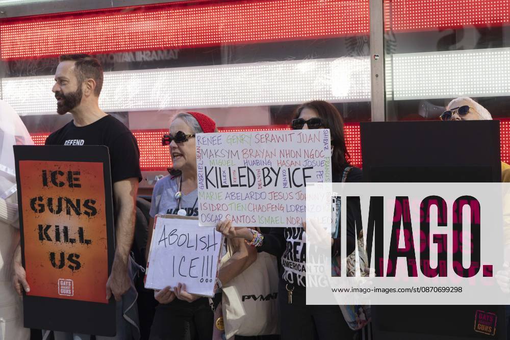 Demonstrators with the anti-gun violence organization Gays Against Guns protest under the Times Square US Army Recruiting Station LED American flag to denounce U.S. Immigration and Customs Enforcement (ICE,) President Trump s immigrant detention and mass deportation policies, and to memorialize the people killed by Federal immigration agents. Protesters chant holding signs that read ICE GUNS KILL US ABOLISH ICE!!! KILLED BY ICE DISARM BOGUS PATRIOTS. New York USA - ZUMAr174 20261025_znp_r174_014